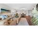 Open living room and dining area with hardwood floors and neutral decor at 5855 Midnight Pass Rd # 311, Sarasota, FL 34242