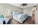 King-size bed, and view of the balcony from the main bedroom at 5855 Midnight Pass Rd # 311, Sarasota, FL 34242