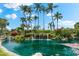 Serene pond with waterfall and tropical landscaping at 5855 Midnight Pass Rd # 311, Sarasota, FL 34242
