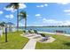 Relaxing waterfront area with gazebo, lounge chairs and benches at 5855 Midnight Pass Rd # 311, Sarasota, FL 34242
