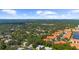 Aerial view of community with lake and surrounding landscape at 5916 Bonaventure Pl, Sarasota, FL 34243