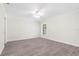 Spacious bedroom featuring wood-look floors and a ceiling fan at 5916 Bonaventure Pl, Sarasota, FL 34243