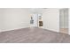 Bright bedroom with wood-look floors and access to bathroom and closet at 5916 Bonaventure Pl, Sarasota, FL 34243