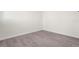 Simple bedroom with light walls, wood-look flooring at 5916 Bonaventure Pl, Sarasota, FL 34243