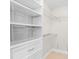 Well-organized closet with shelving and wire baskets at 5916 Bonaventure Pl, Sarasota, FL 34243