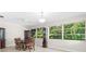 Elegant dining room with a wood table and chairs, and built-in hutch at 5916 Bonaventure Pl, Sarasota, FL 34243