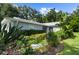 Well-maintained home with lush landscaping and a walkway at 5916 Bonaventure Pl, Sarasota, FL 34243