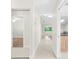 Bright hallway with tile floors and access to bedrooms at 5916 Bonaventure Pl, Sarasota, FL 34243