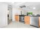 Modern kitchen with stainless steel appliances and wood cabinets at 5916 Bonaventure Pl, Sarasota, FL 34243