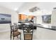 Bright kitchen boasts a breakfast bar, modern appliances, and ample cabinet space at 5916 Bonaventure Pl, Sarasota, FL 34243