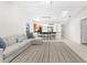 Bright and airy living room with a comfortable sectional sofa and area rug at 5916 Bonaventure Pl, Sarasota, FL 34243