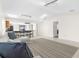 Open living area features a sectional sofa, view into kitchen, and skylight at 5916 Bonaventure Pl, Sarasota, FL 34243