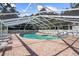 Inviting community pool with covered patio and lounge chairs at 5916 Bonaventure Pl, Sarasota, FL 34243