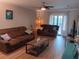 Relaxing living room with hardwood floors and access to balcony at 6033 34Th W St # 138, Bradenton, FL 34210