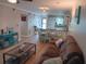 Bright living room featuring hardwood floors and comfy seating at 6033 34Th W St # 138, Bradenton, FL 34210