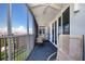 Screened balcony with patio furniture and ocean view at 6300 Midnight Pass Rd # 708, Sarasota, FL 34242