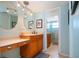 Double vanity bathroom with updated fixtures and a large shower at 6300 Midnight Pass Rd # 708, Sarasota, FL 34242