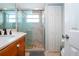 Bathroom with a walk-in shower and updated vanity at 6300 Midnight Pass Rd # 708, Sarasota, FL 34242