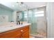 Bathroom with a walk-in shower and updated vanity at 6300 Midnight Pass Rd # 708, Sarasota, FL 34242