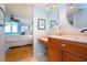 Bathroom with single vanity and view of bedroom at 6300 Midnight Pass Rd # 708, Sarasota, FL 34242