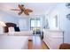 Bright bedroom with two twin beds, ocean view, and built-in dresser at 6300 Midnight Pass Rd # 708, Sarasota, FL 34242