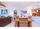 Bright dining area featuring a rustic wood table and wicker chairs at 6300 Midnight Pass Rd # 708, Sarasota, FL 34242
