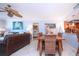 Charming dining area with a rustic wood table and wicker chairs at 6300 Midnight Pass Rd # 708, Sarasota, FL 34242