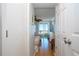 Bright hallway with view of bedroom and balcony at 6300 Midnight Pass Rd # 708, Sarasota, FL 34242
