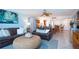 Spacious living room with leather sofas and a view into dining area at 6300 Midnight Pass Rd # 708, Sarasota, FL 34242