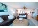 Comfortable living room with leather sofas and a view into dining area at 6300 Midnight Pass Rd # 708, Sarasota, FL 34242