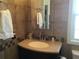 Bathroom with updated vanity and tiled shower at 763 Lakeside Dr, North Port, FL 34287