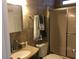Bathroom with shower, vanity, and tiled walls at 763 Lakeside Dr, North Port, FL 34287
