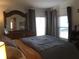 Bright bedroom with large windows and comfortable bed at 763 Lakeside Dr, North Port, FL 34287