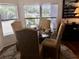Bright dining area with glass table and four chairs at 763 Lakeside Dr, North Port, FL 34287