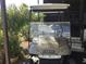 Tan EZGO golf cart parked near home entrance at 763 Lakeside Dr, North Port, FL 34287