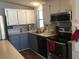 Modern kitchen features stainless steel appliances and ample cabinetry at 763 Lakeside Dr, North Port, FL 34287