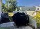 Small patio with covered grill and privacy lattice at 763 Lakeside Dr, North Port, FL 34287
