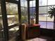 Relaxing sunroom with multiple windows and outdoor view at 763 Lakeside Dr, North Port, FL 34287
