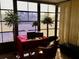 Sunroom offers bright workspace with ample natural light at 763 Lakeside Dr, North Port, FL 34287