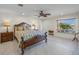 Spacious bedroom with large bed and water views at 929 Casey Cove Dr, Nokomis, FL 34275
