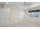 Spacious bedroom with neutral walls, ceiling fan, and tile floors at 929 Casey Cove Dr, Nokomis, FL 34275
