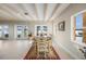 Casual dining area with water views and French doors at 929 Casey Cove Dr, Nokomis, FL 34275
