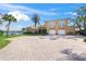 Luxury waterfront home with paver driveway and lush landscaping at 929 Casey Cove Dr, Nokomis, FL 34275