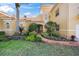 Welcoming front entrance with a landscaped walkway and teal door at 929 Casey Cove Dr, Nokomis, FL 34275