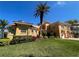 Two-story waterfront home with palm trees at 929 Casey Cove Dr, Nokomis, FL 34275
