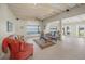 Spacious living room with water views and exposed beam ceiling at 929 Casey Cove Dr, Nokomis, FL 34275