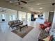 Open concept living area with kitchen and water views at 929 Casey Cove Dr, Nokomis, FL 34275