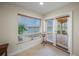 Bright office space with French doors leading to patio and water views at 929 Casey Cove Dr, Nokomis, FL 34275