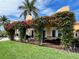 Relaxing patio covered in vibrant bougainvillea at 929 Casey Cove Dr, Nokomis, FL 34275