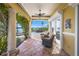 Relaxing waterfront patio with wicker chairs and pool access at 929 Casey Cove Dr, Nokomis, FL 34275